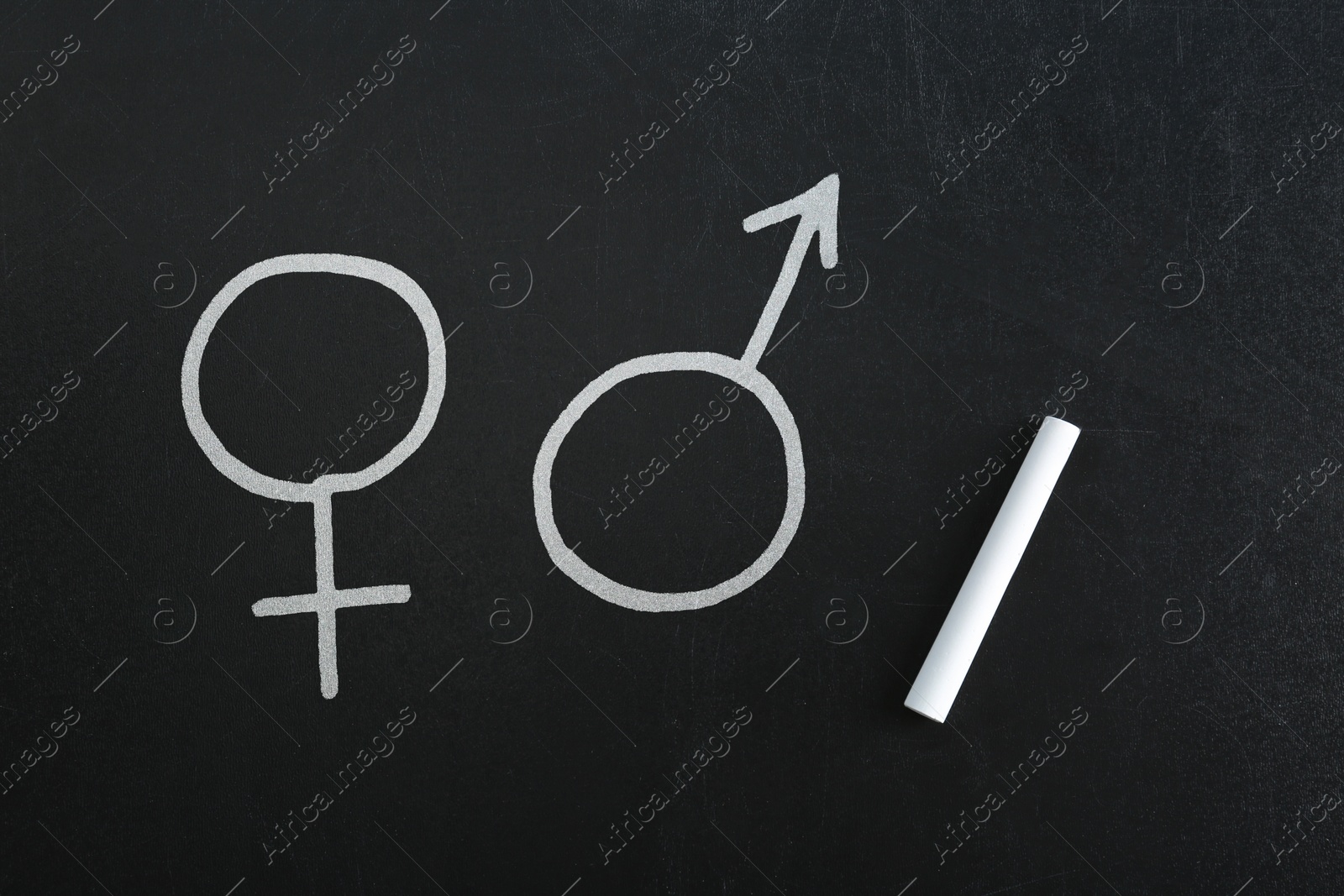 Sex education. Female and male gender signs on black chalkboard Image of Sex education. Female and male gender signs on black chalkboard