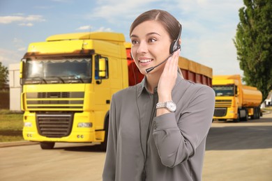 Image of Car service worker with headset against trucks outdoors. Client support