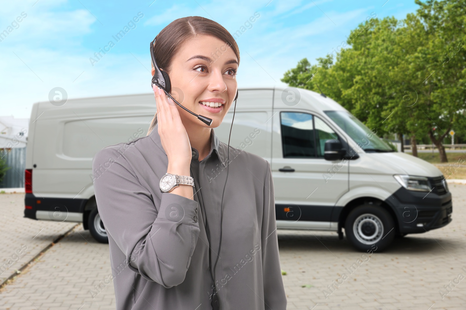 Car service worker with headset against vehicle outdoors. Client support Image of Car service worker with headset against vehicle outdoors. Client support