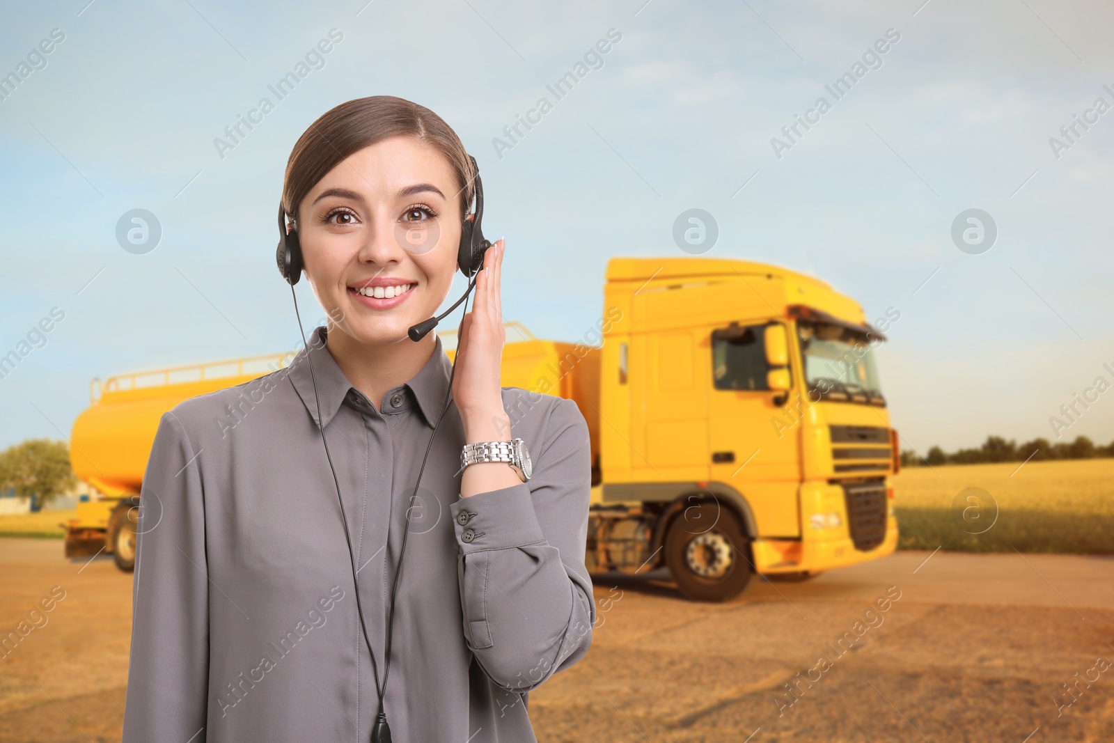 Car service worker with headset against truck outdoors. Client support Image of Car service worker with headset against truck outdoors. Client support