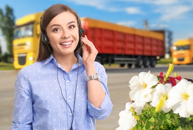 Image of Car service worker with headset against truck outdoors. Client support