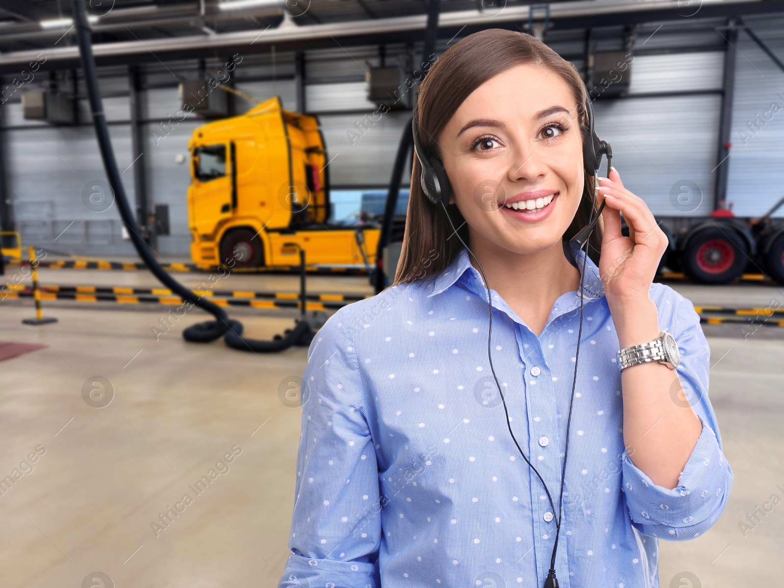Car service worker with headset against truck at station. Client support Image of Car service worker with headset against truck at station. Client support