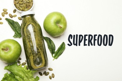 Image of Superfood. Healthy smoothie in glass bottle and ingredients on white table, top view