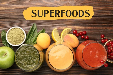 Image of Superfoods. Healthy smoothies in glasses and ingredients on wooden table, top view