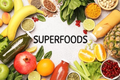 Image of Superfoods. Healthy smoothies in glass bottles and ingredients on table, top view