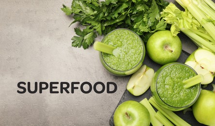 Image of Superfood. Healthy smoothie in glasses and ingredients on grey table, top view