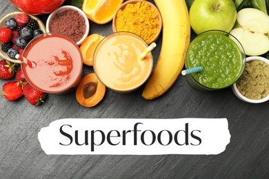 Image of Superfoods. Healthy smoothies in glasses and ingredients on grey table, top view