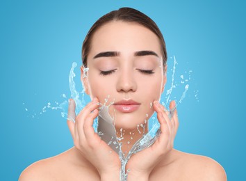 Image of Woman with smooth skin and water splash against light blue background
