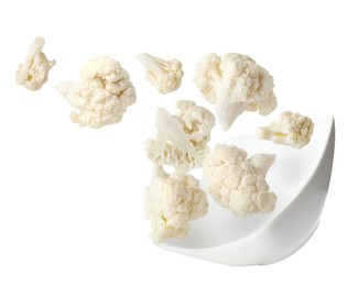 Image of Cauliflower florets and bowl in air against white background