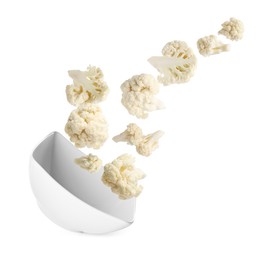 Image of Cauliflower florets and bowl in air against white background