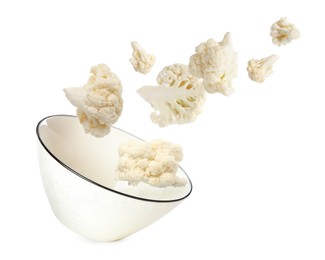 Image of Cauliflower florets and bowl in air against white background