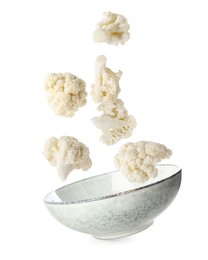Image of Cauliflower florets and bowl in air against white background