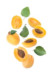 Image of Fresh juicy apricots flying against white background