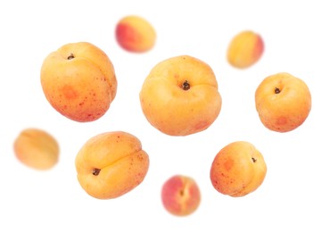 Image of Fresh juicy apricots swirling in air against white background