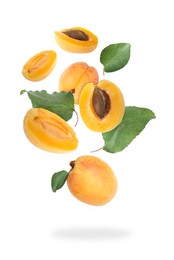 Image of Fresh juicy apricots falling against white background