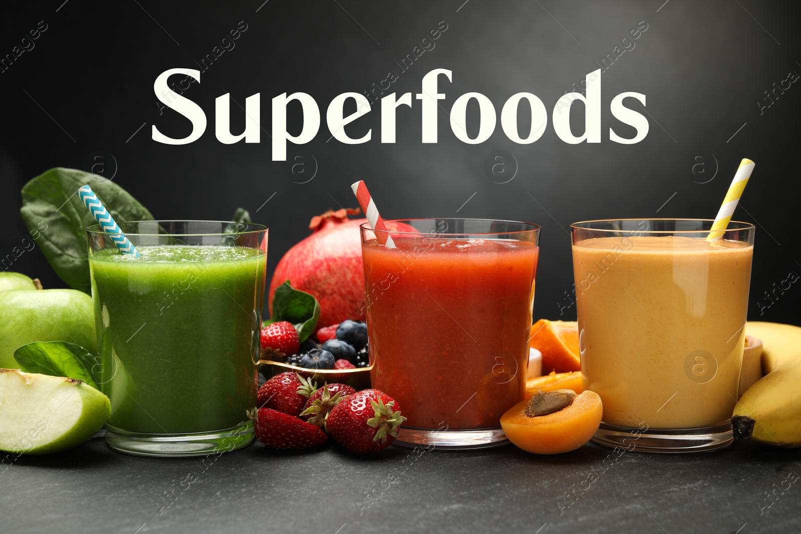 Image of Superfoods. Healthy smoothies in glasses and ingredients on table