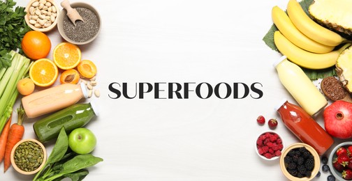 Image of Superfoods. Healthy smoothies in glass bottles and ingredients on table, top view