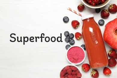 Image of Superfood. Healthy smoothie in glass bottle and ingredients on white table, top view