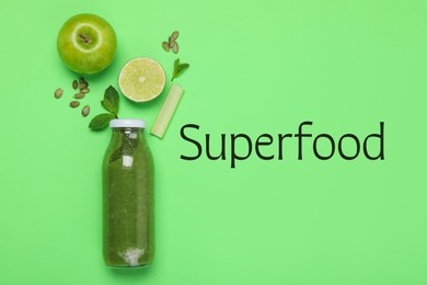 Image of Superfood. Healthy smoothie in glass bottle and ingredients on green background, top view