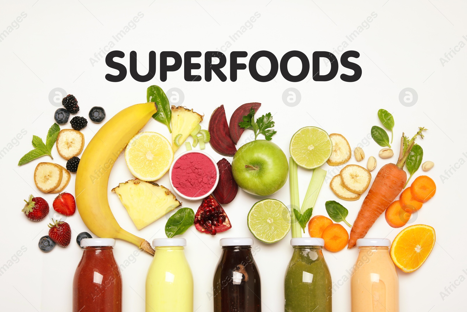 Image of Superfoods. Healthy smoothies in glass bottles and ingredients on white table, top view