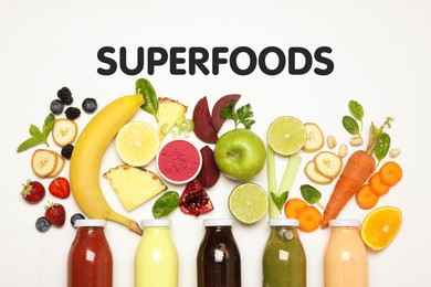 Image of Superfoods. Healthy smoothies in glass bottles and ingredients on white table, top view