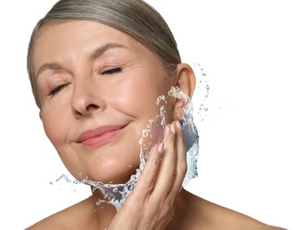 Image of Woman with smooth skin and water splash against white background