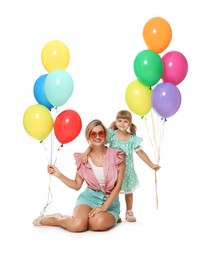 Photo of Happy mother in sunglasses and her little daughter with bunches of colorful balloons on white background