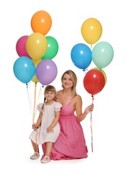 Photo of Happy mother in dress and her little daughter with bunches of colorful balloons on white background