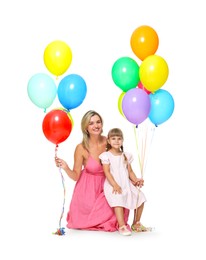 Photo of Happy mother in dress and her little daughter with bunches of colorful balloons on white background
