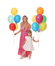 Photo of Happy mother in dress and her little daughter with bunches of colorful balloons on white background