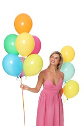 Photo of Smiling woman in dress with bunches of colorful balloons on white background