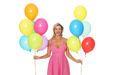 Photo of Happy woman in dress with bunches of colorful balloons on white background