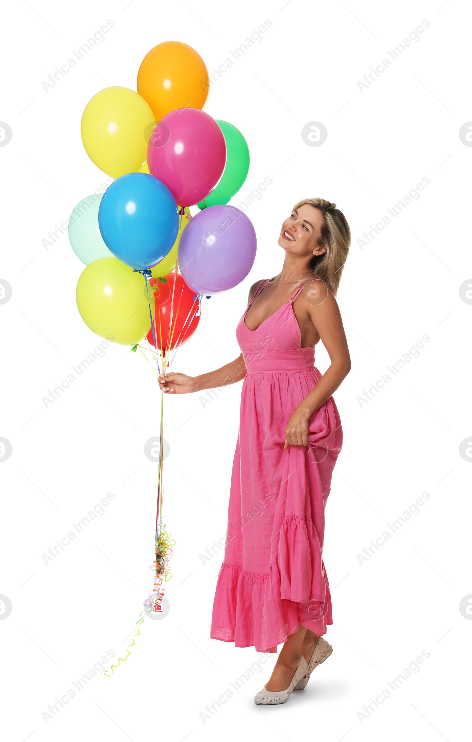Smiling woman in dress with bunch of colorful balloons on white background Photo of Smiling woman in dress with bunch of colorful balloons on white background
