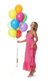 Photo of Smiling woman in dress with bunch of colorful balloons on white background