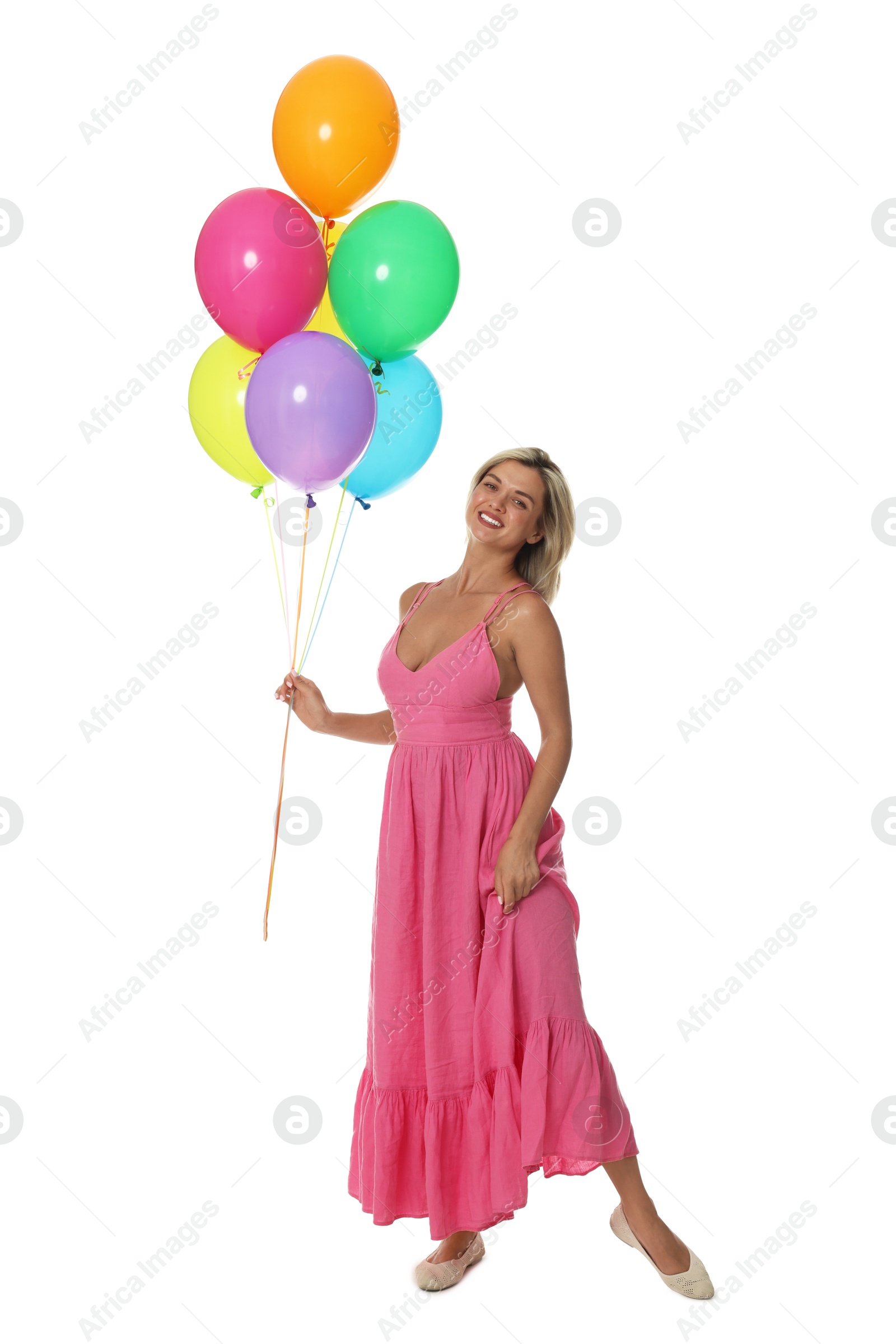 Smiling woman in dress with bunch of colorful balloons on white background Photo of Smiling woman in dress with bunch of colorful balloons on white background