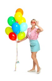 Photo of Smiling woman in sunglasses with bunch of colorful balloons on white background