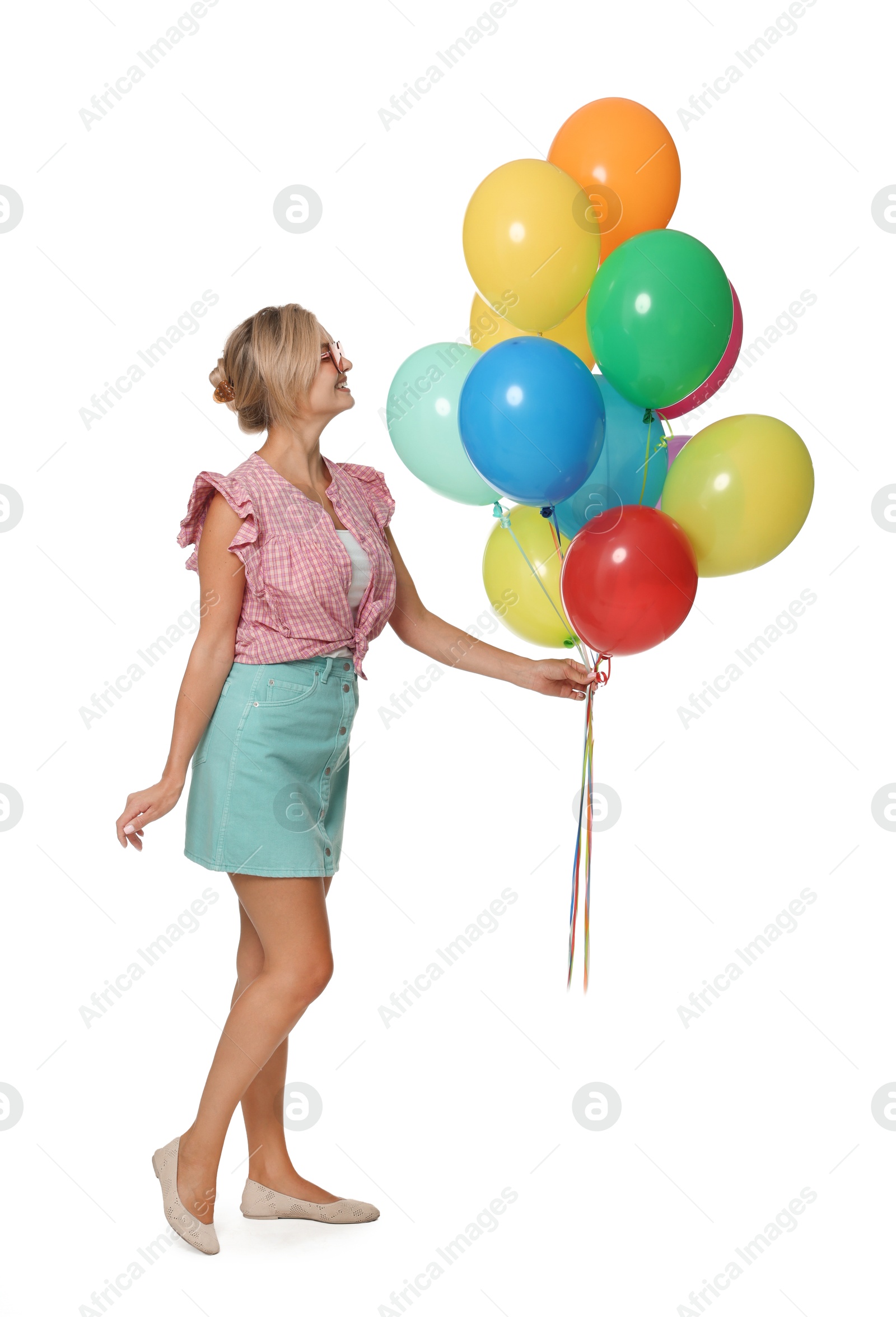 Photo of Smiling woman in sunglasses with bunch of colorful balloons on white background