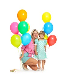 Photo of Happy mother in sunglasses and her little daughter with bunches of colorful balloons on white background