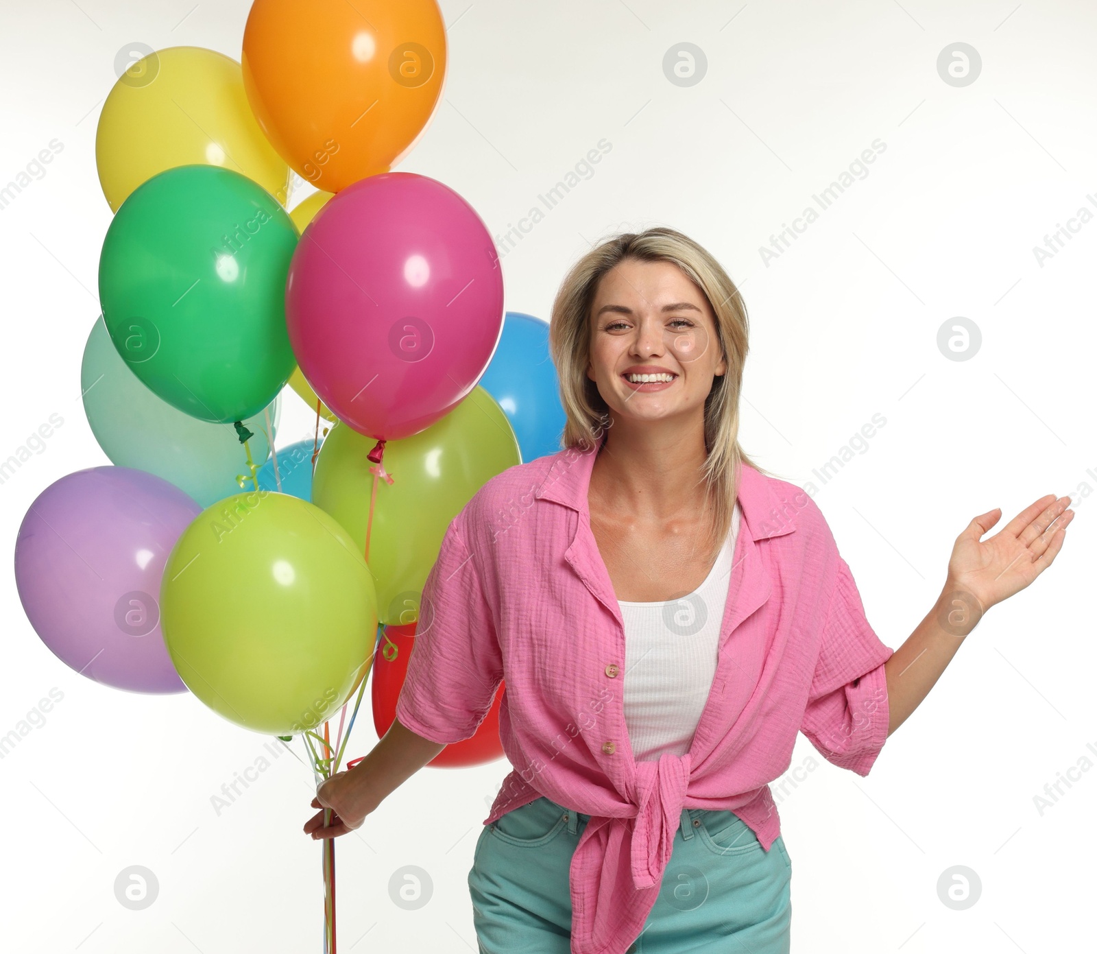 Photo of Smiling woman with bunch of colorful balloons on white background