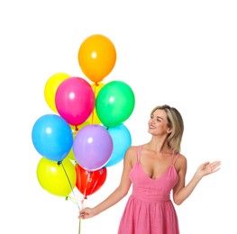 Photo of Smiling woman in dress with bunch of colorful balloons on white background