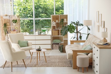 Photo of Stylish sofa and other furniture in living room. Interior design