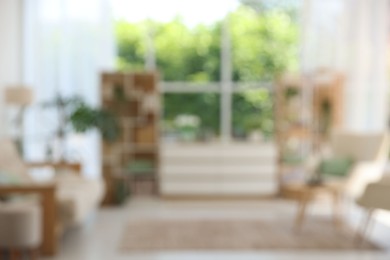 Photo of Blurred view of stylish furniture in living room. Interior design