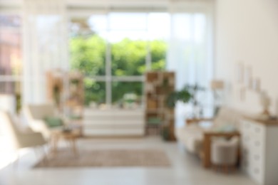 Photo of Blurred view of stylish furniture in living room. Interior design