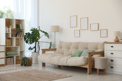Photo of Stylish sofa and other furniture in living room. Interior design