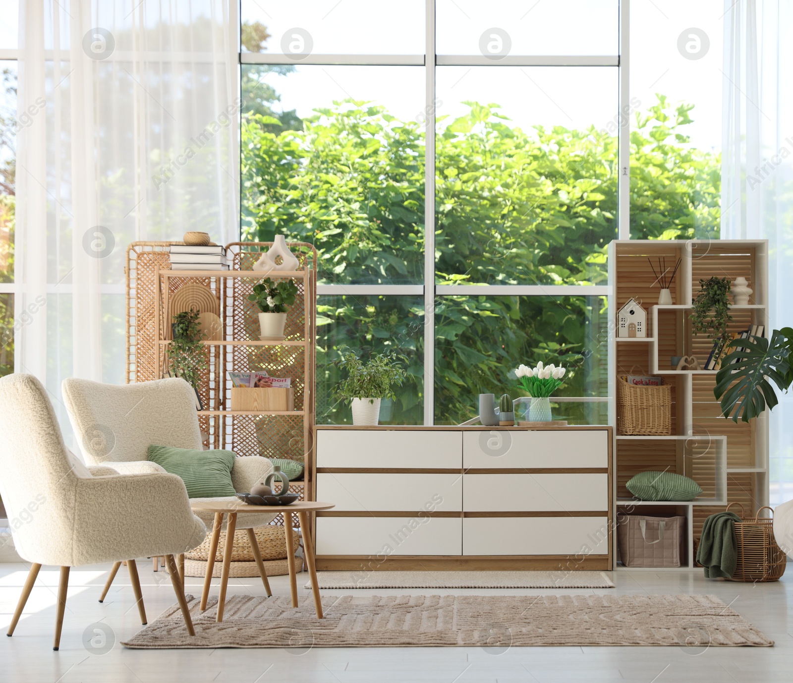 Comfortable armchairs and other furniture in living room. Interior design Photo of Comfortable armchairs and other furniture in living room. Interior design