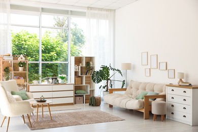 Photo of Stylish sofa and other furniture in living room. Interior design