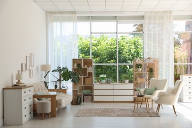 Photo of Stylish sofa and other furniture in living room. Interior design