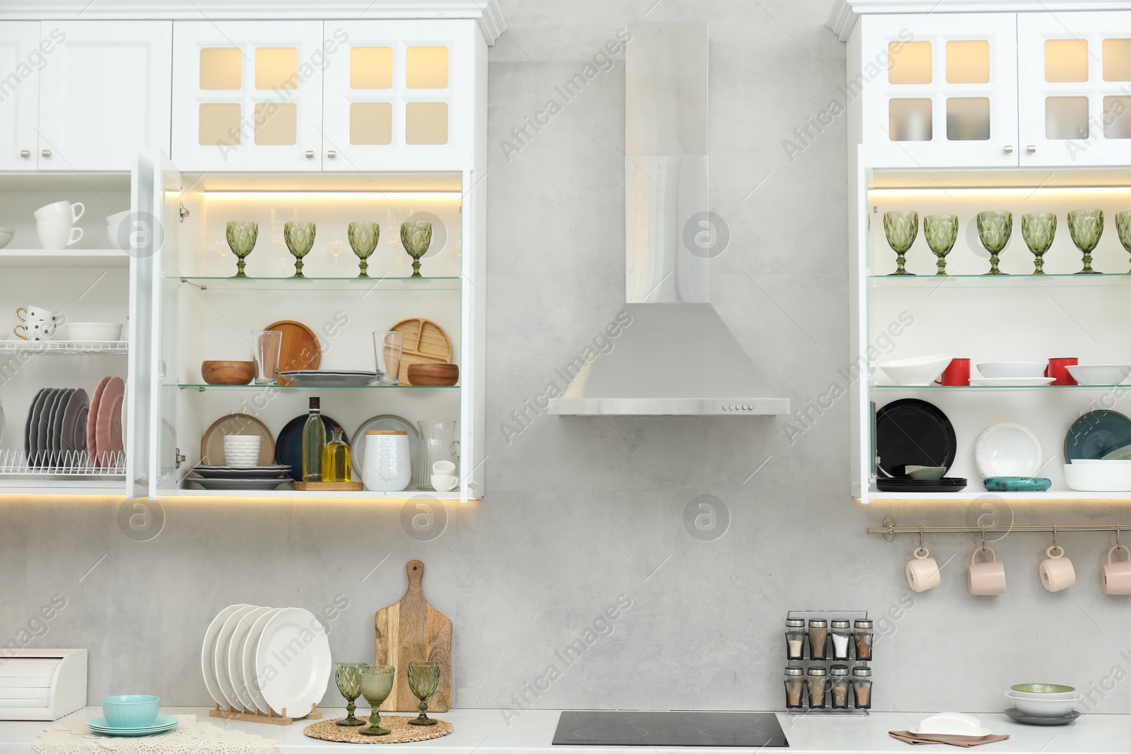 Different dishware, glasses and other kitchen utensils indoors Photo of Different dishware, glasses and other kitchen utensils indoors