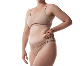 Photo of Liposuction. Woman in underwear touching her belly on white background, closeup