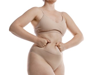 Photo of Liposuction. Woman in underwear touching her belly on white background, closeup